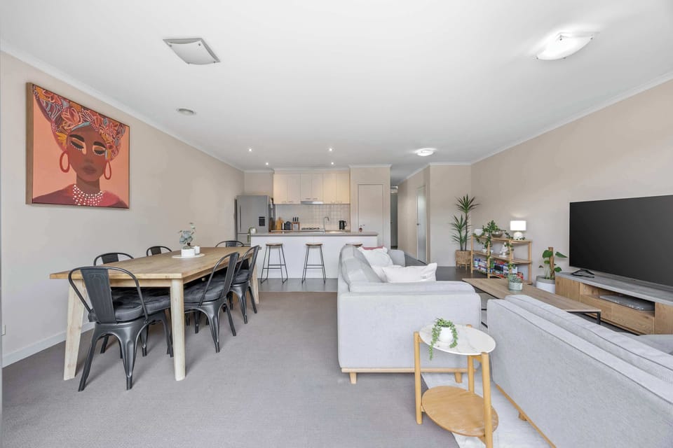 Open plan living, dining and kitchen space.