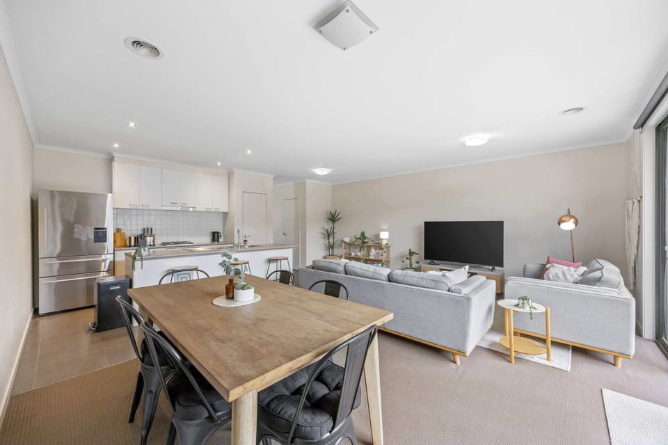 Open plan living, dining and kitchen space.