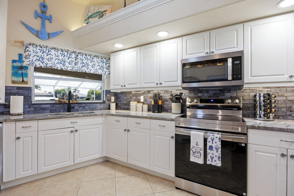 Kitchen with granite counter tops and stainless steel appliances