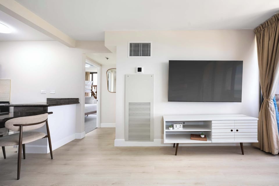 Kick back and enjoy your favorite shows on your 65" wall-mounted smart TV in your living area.