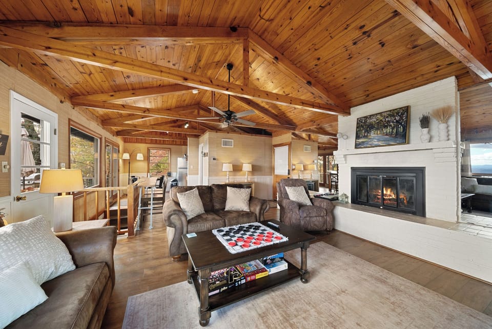 Vaulted Wood Ceilings and Exposed Beams, Wood Burning Fireplace and Plenty of Seating
