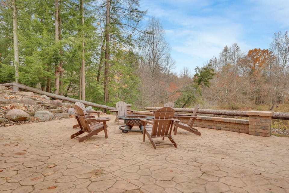 Relax by the fire with beautiful views of the forest and water