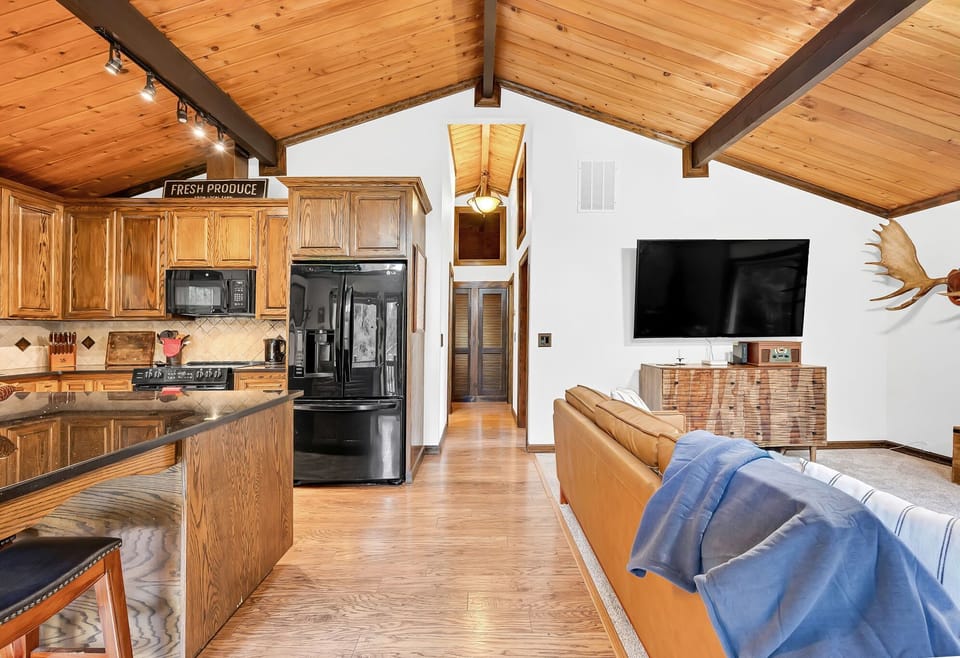 Fully equipped kitchen with modern appliances and open-concept design perfect for entertaining.