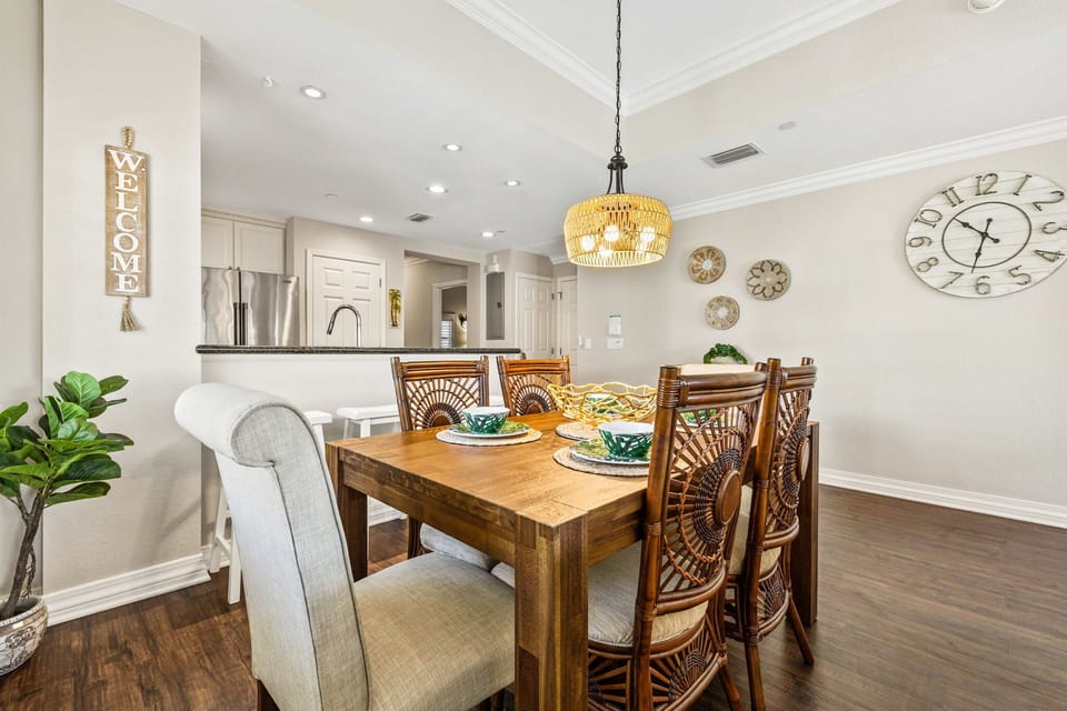 Modern dining space with warm wood-style floors — perfect for family meals.