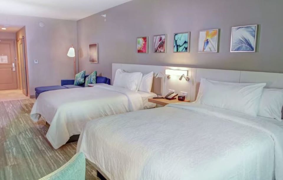 Unwind in bright comfort with two plush beds and sofa.