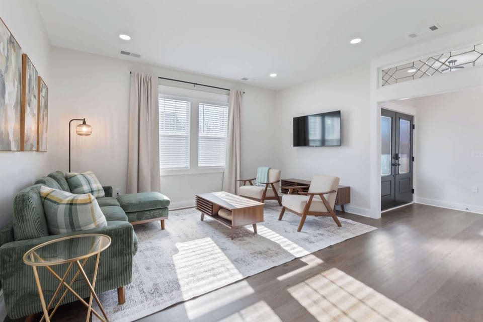 A thoughtfully designed living space where clean lines meet comfort, perfect for lounging after a day of exploring or simply unwind as natural light fills the space.