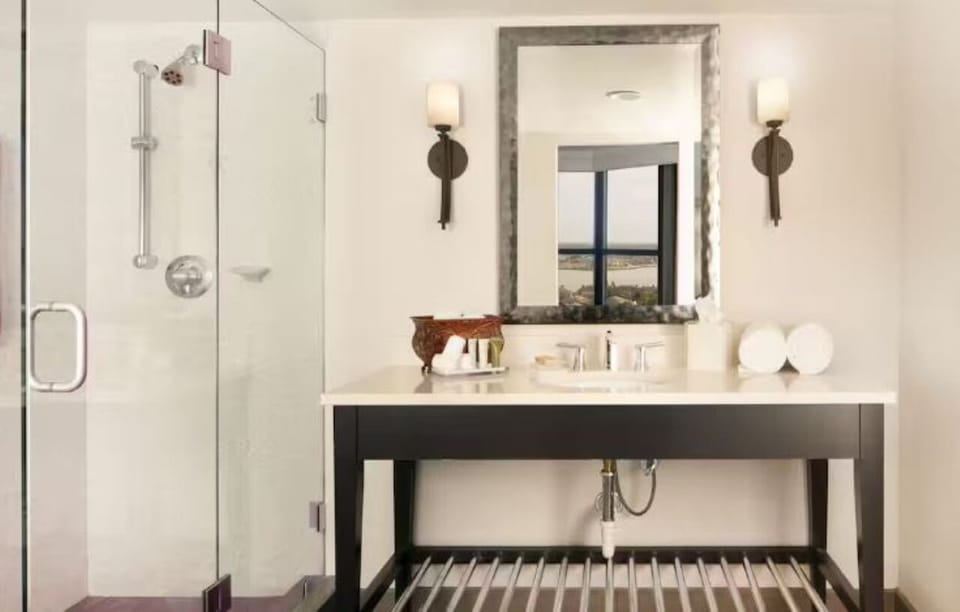 Refresh in a bright spa-style bath with glass shower.