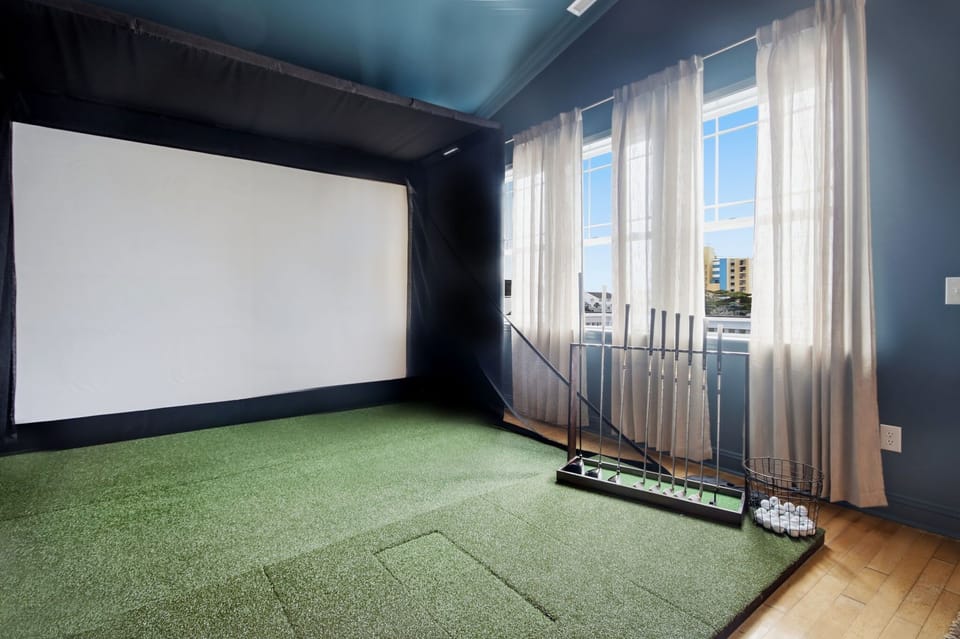 Rain or shine, this private lounge and professional golf simulator let you perfect your swing, play iconic courses online, and crack a few cold drinks with friends—all without ever leaving the comfort of your beach retreat. 