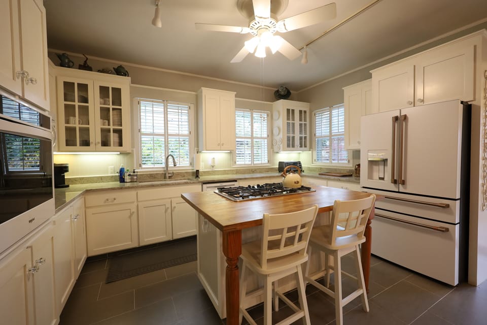 Kitchen with new appliances and island bar seating