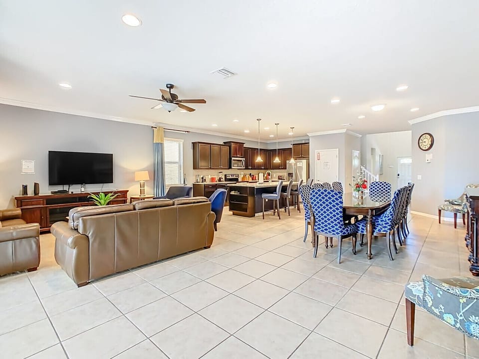 Enjoy a bright, open-concept living and dining area with natural light and a warm, cozy atmosphere