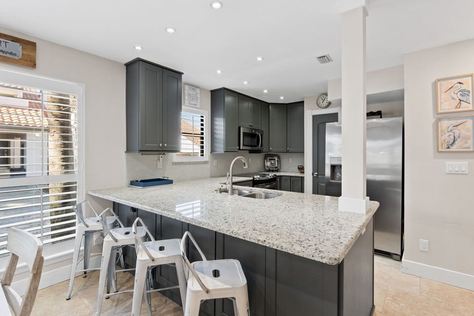 Fully Equipped Kitchen ~ Bar Seating for 4. Enjoy a fresh moring cup of coffee to start your day or an evening libation after a fun day on the beach. 

Professionally Managed by
Breathe Easy Rentals