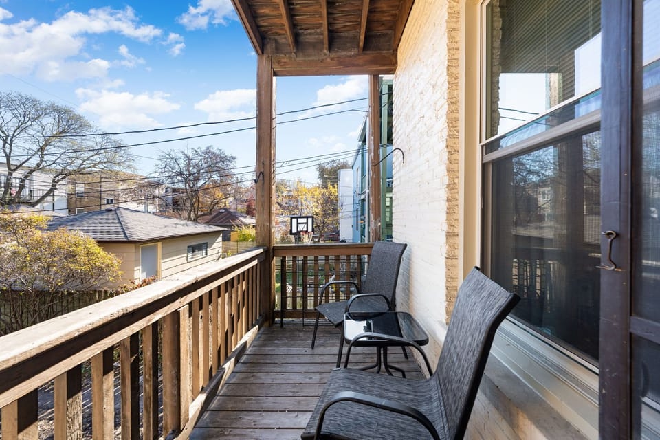 Covered balcony w/ seating to enjoy fresh air and peaceful moments outside.