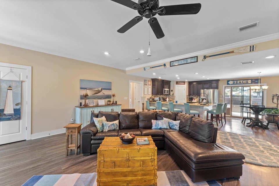 Living room is open to the kitchen with a large sectional couch.  Perfect for movie nights or streaming your perfect show.