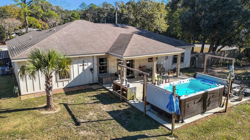 Backyard Paradise!  Relax in the hot tub, sit in the shade and enjoy the lights at night.