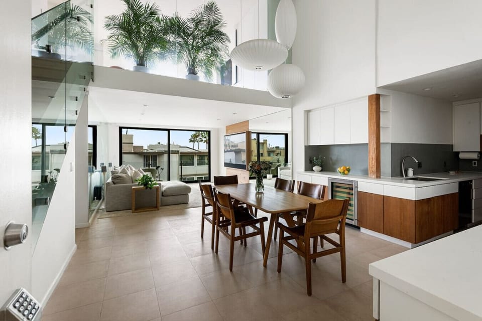 An elegant 6-seater dining space with natural light and a clean, modern aesthetic, ideal for dining together and creating lasting memories.