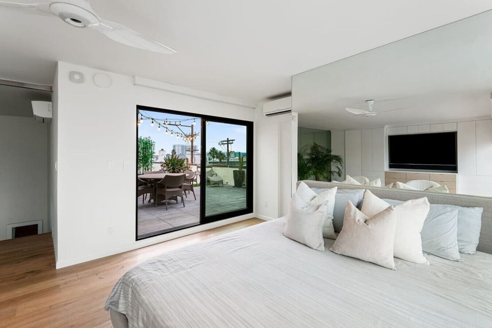Enjoy a serene escape in these carefully designed bedrooms with breathtaking ocean views, flooded with natural light and featuring modern, comfortable furnishings.