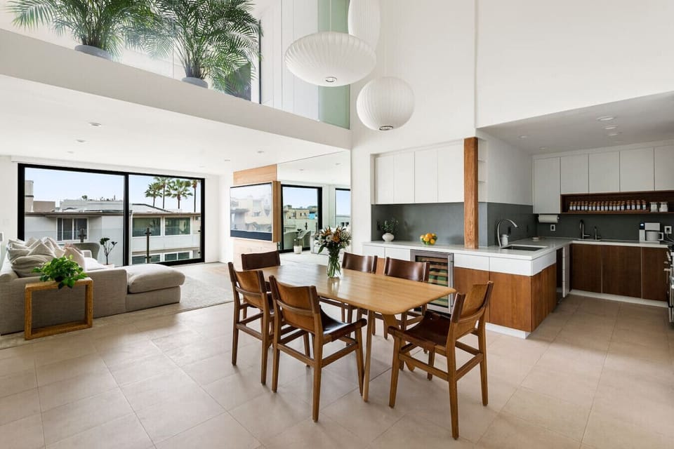 An elegant 6-seater dining space with natural light and a clean, modern aesthetic, ideal for dining together and creating lasting memories.