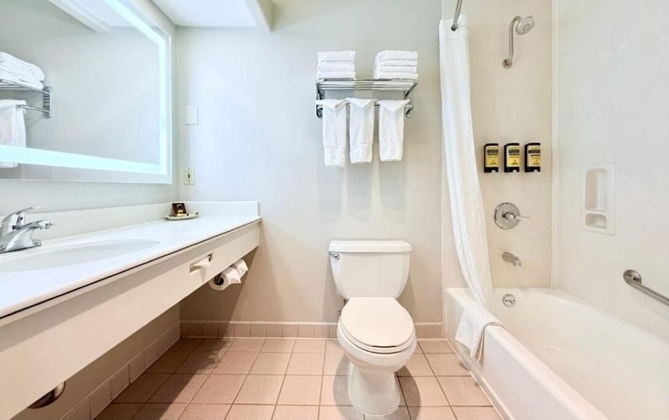 Refresh easily with bright vanity space and a full tub.