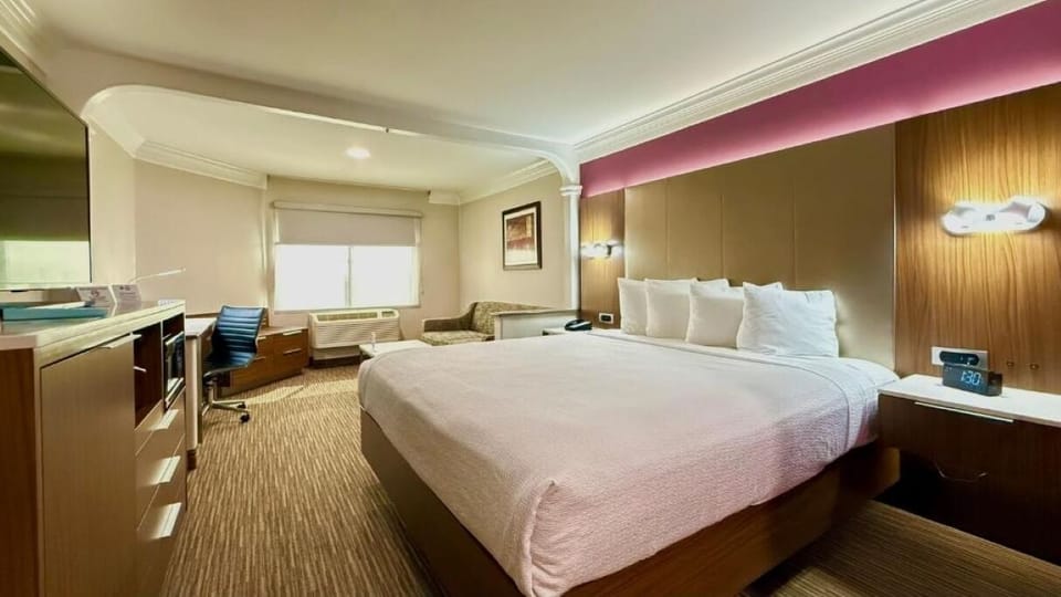 Stretch out on a generous king bed after a long day.