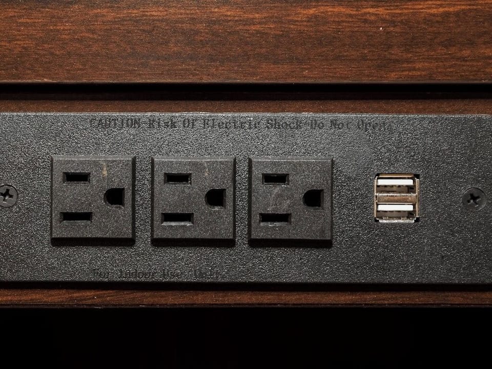 Plug in effortlessly with bedside outlets and USB charging.