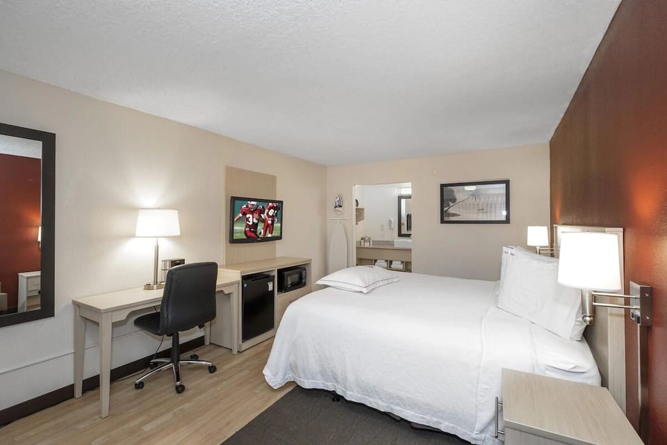 Work or relax with a roomy desk beside your bed.