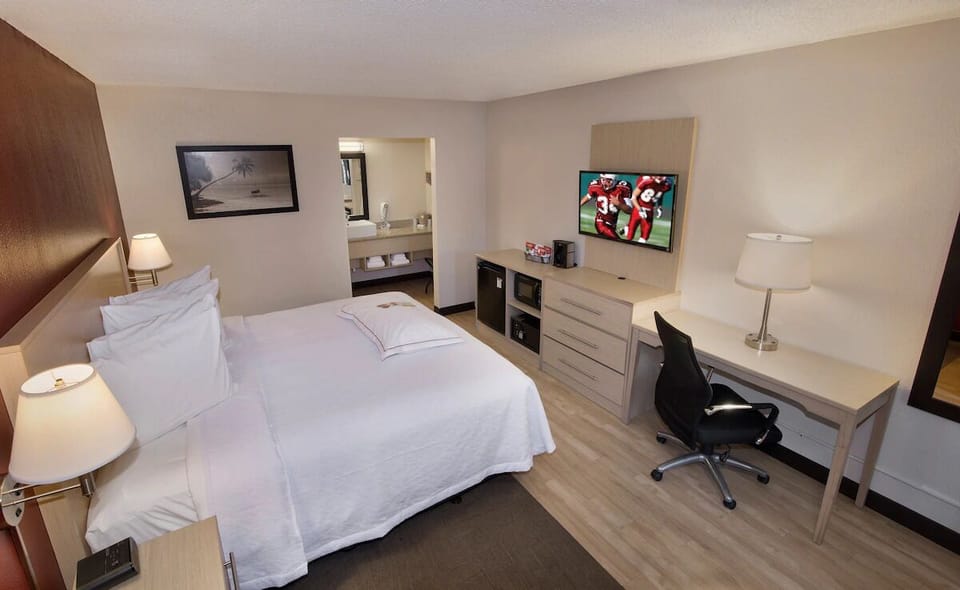 Kick back with TV, desk space, and room to breathe.