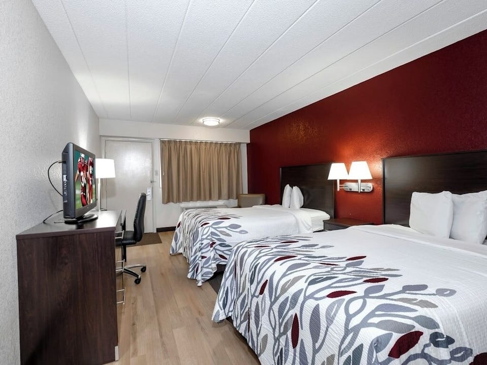 Settle into a bright double-queen room with workspace.