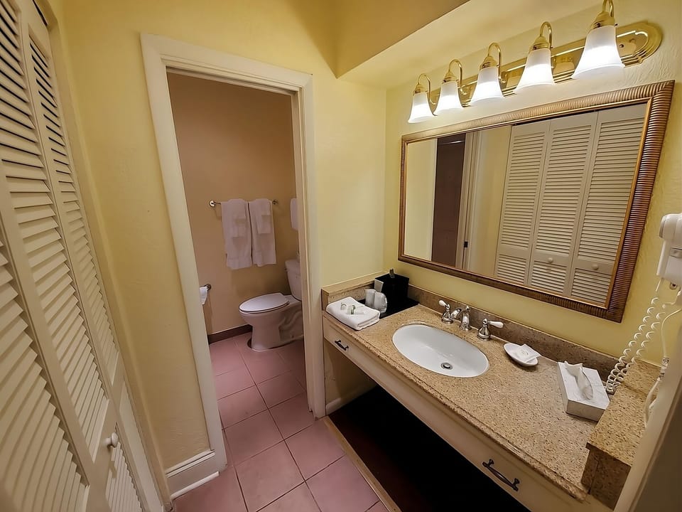 Refresh easily at a spacious vanity with bright, flattering lighting.