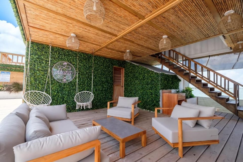 Sink into shaded sofas and sip cocktails in coastal comfort.