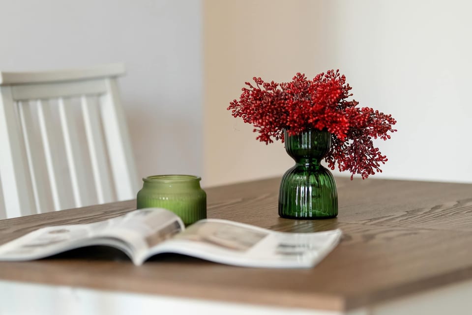 Tastefully arranged dining table with fresh flowers creating a welcoming feel.