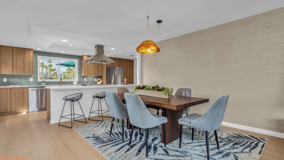 Indoor dining seats 6 at the table and 3 at the peninsula