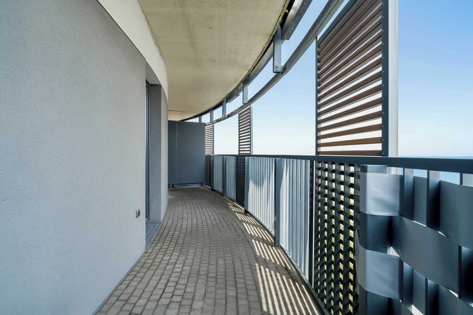 The balcony provides a serene environment for relaxation. 
