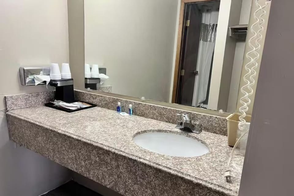 Get ready comfortably with generous counter space and mirror.