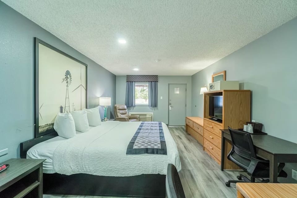 Unwind in a spacious king room with work desk.
