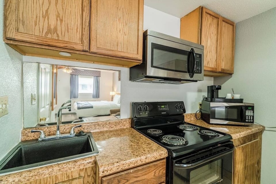 Cook quick meals in this bright kitchenette with full stove.