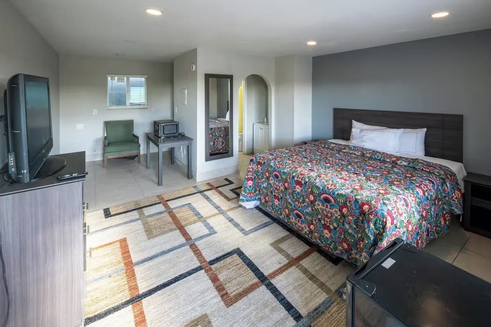 Unwind in a bright, spacious room with plush bedding.