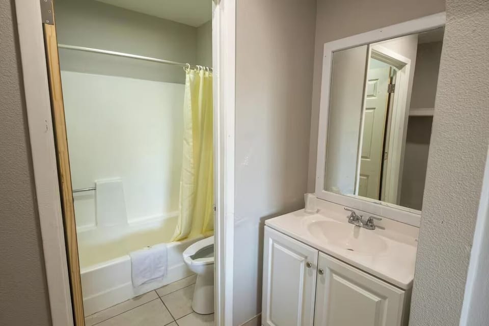 Refresh easily with a bright vanity and clean tub-shower.
