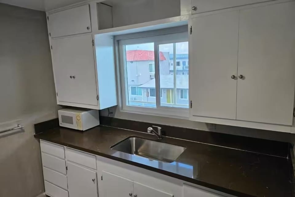 Prep easy meals with a convenient kitchenette and sunny sink.