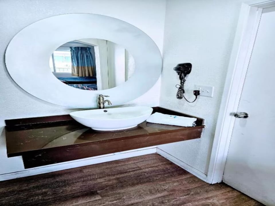 Freshen up at a stylish vanity with bright mirror lighting.