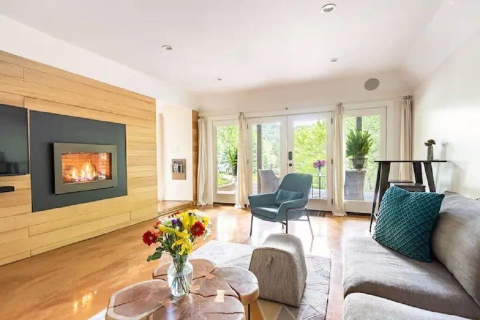Living room area with plenty of natural light and curtains for privacy