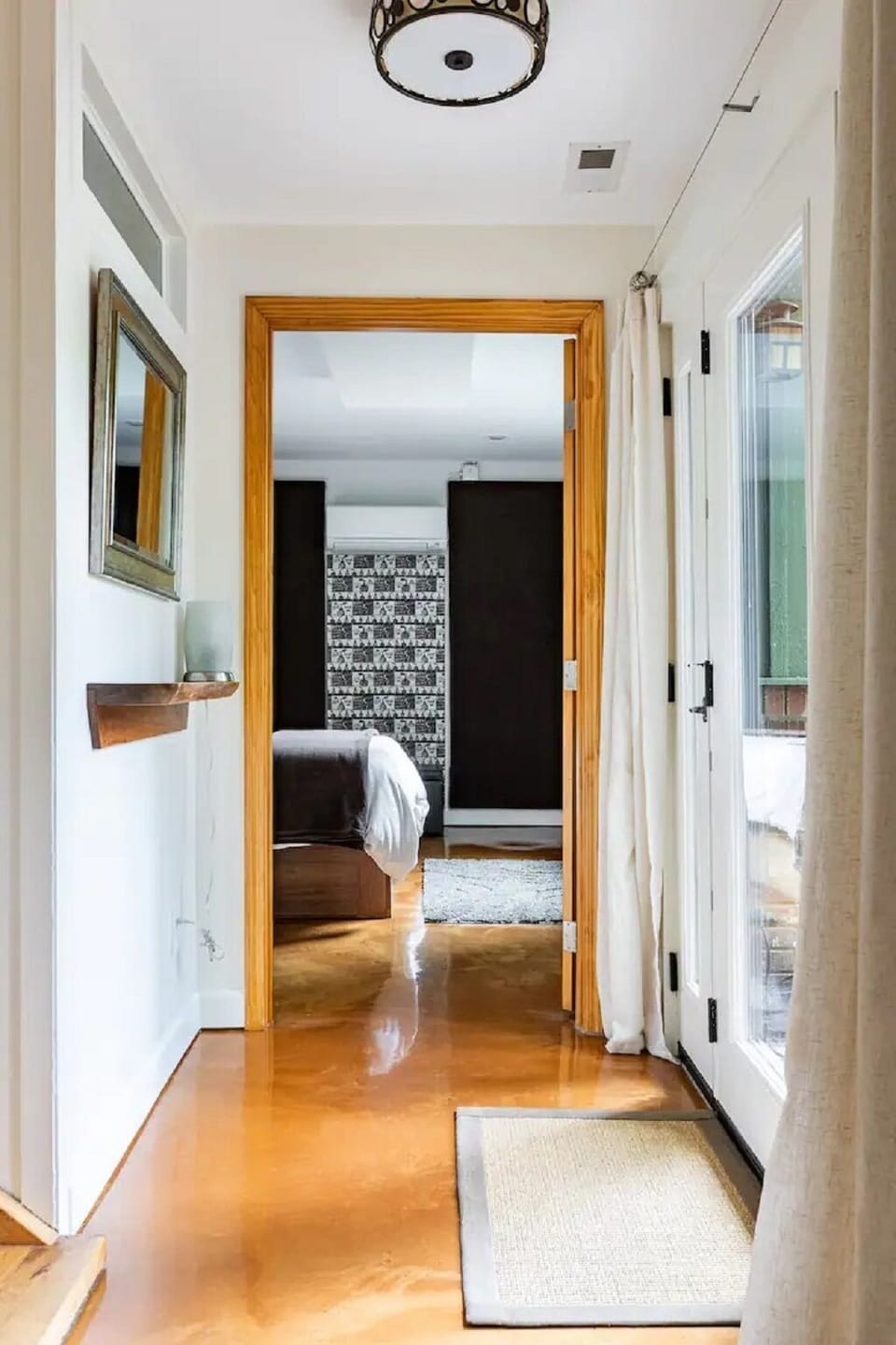 View from Living Room to foyer area leading to bedroom