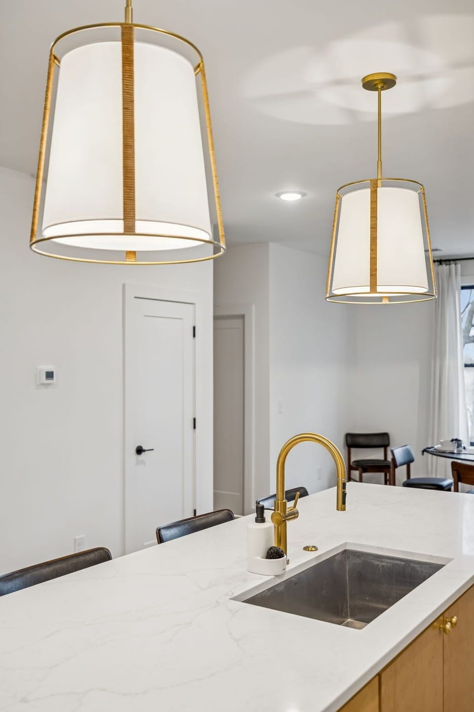 Kitchen: Sleek lines, warm tones, and high-end touches — the perfect kitchen for cooking, entertaining, and enjoying life together.