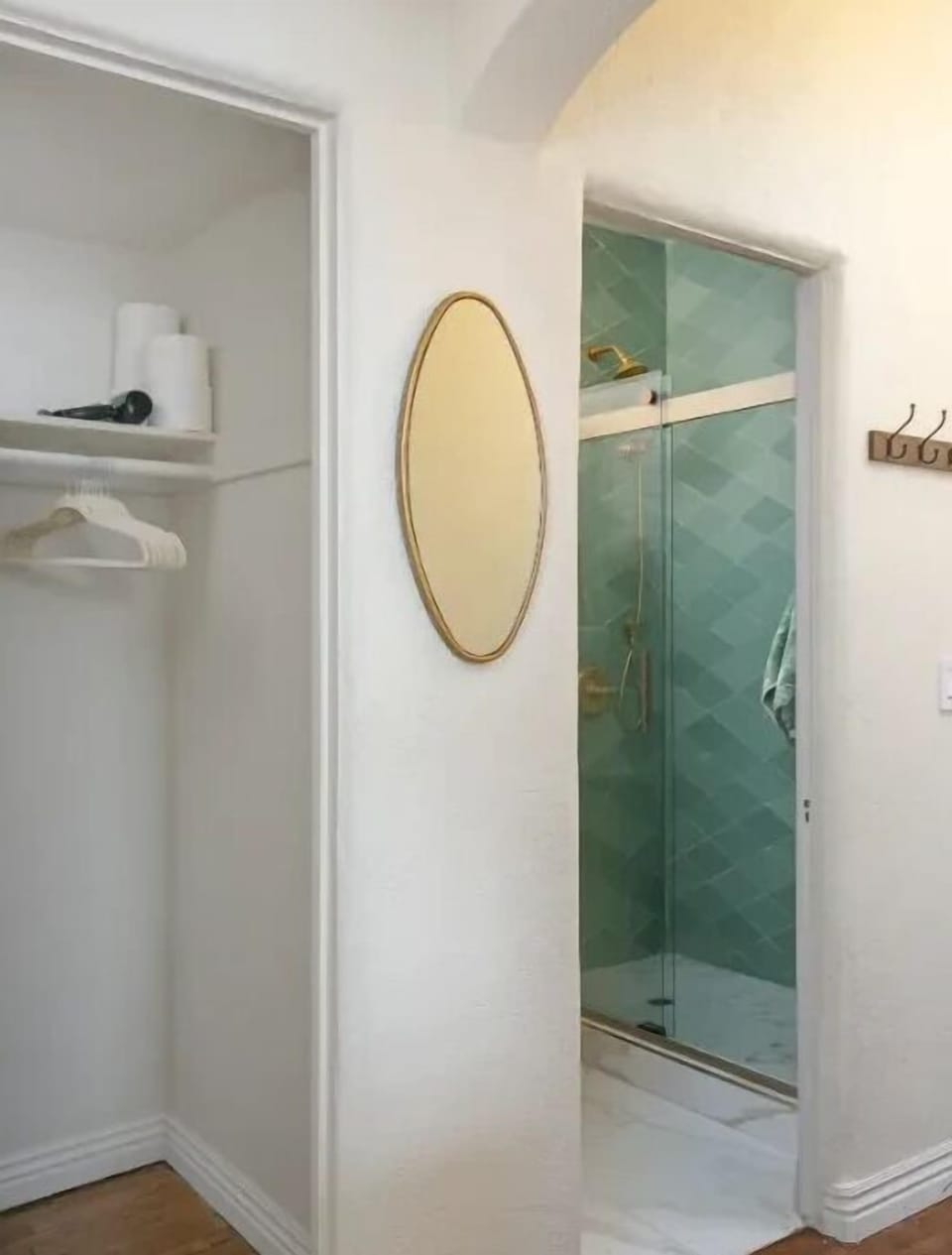 Your stylish ensuite features a glass-enclosed shower and convenient built-in wardrobe with thoughtful storage touches.