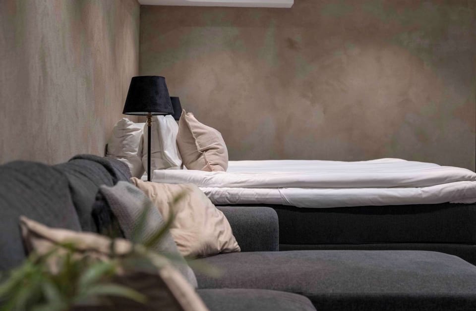 The comfortable 180 cm bed in a separate part of the apartment.
