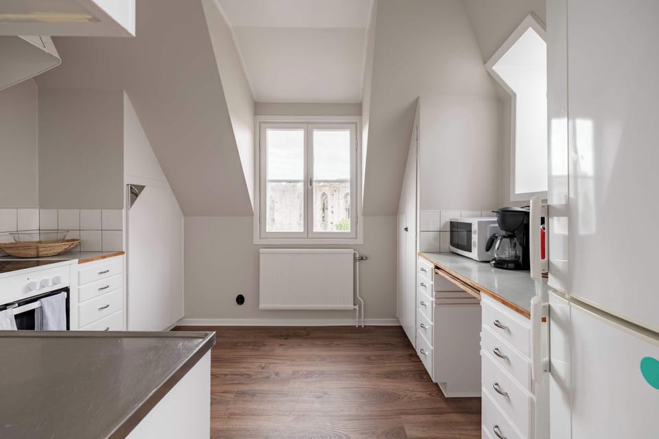 The fully equipped kitchen with all essentials you will need for a home cooked meal. There is a stove, oven, fridge, freezer, kettle, coffee maker, toaster, microwave and essentials.