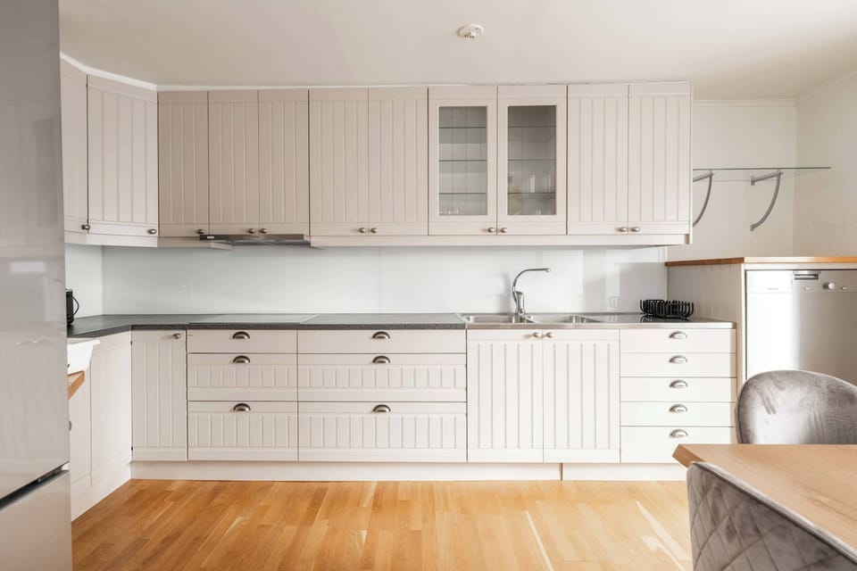 The fully equipped kitchen with all essentials you will need for a home cooked meal. There is a stove, oven, fridge, freezer, dishwasher, microwave, kettle, coffee maker and essentials.