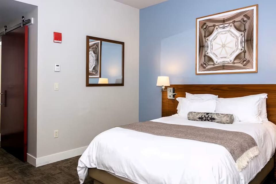 Unwind in crisp linens with calming, modern hotel comfort.