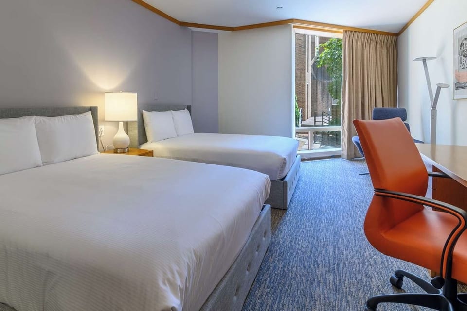 Stretch out in a spacious double room with soft window light.