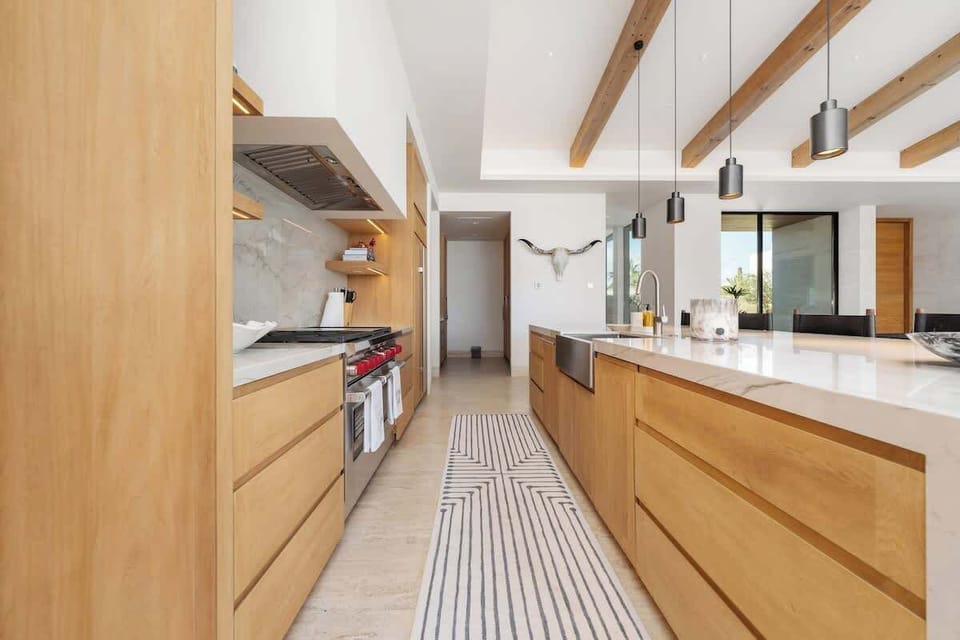 Gather here, where the kitchen opens to paradise.