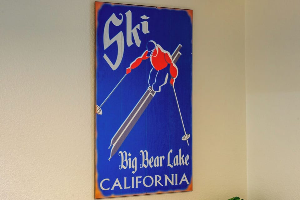 Vintage ski poster displays Big Bear Lake California, showing the area's winter sports heritage and mountain recreation history.
